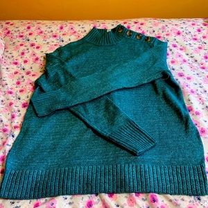 Blue-green warm sweater.